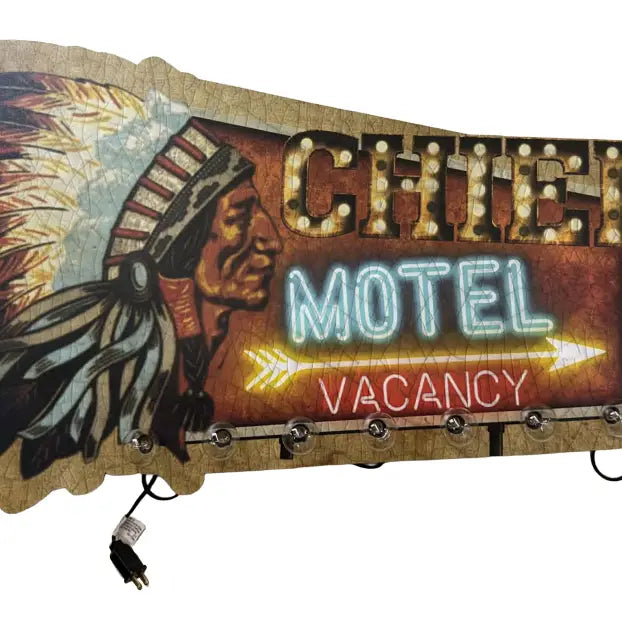 Neon sign for a motel with an Indian chief design on a white background