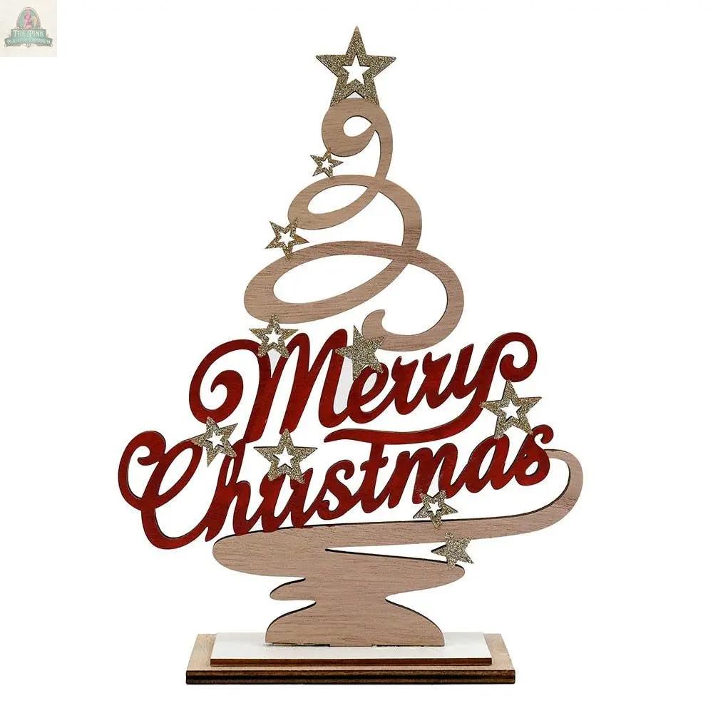 The Merry Christmas Standing Tree Decoration features swirling wooden branches, gold glitter stars, bold red "Merry Christmas" script, and sits on a small rectangular base—perfect for festive home décor.