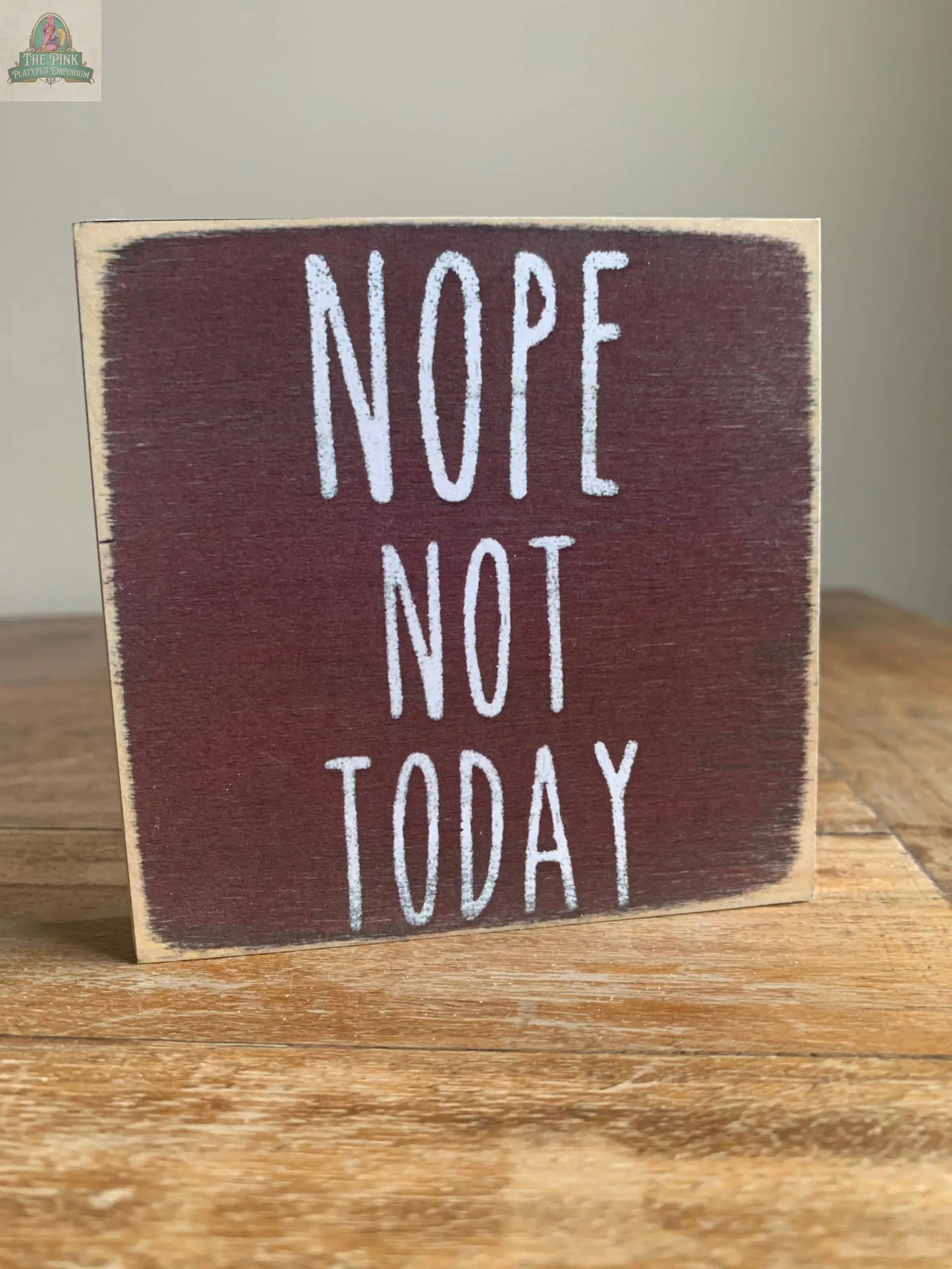 The Pink Platypus Emporium 4X4- Nope block sign features “NOPE NOT TODAY” in white on a dark red background—perfect for home decor displays.
