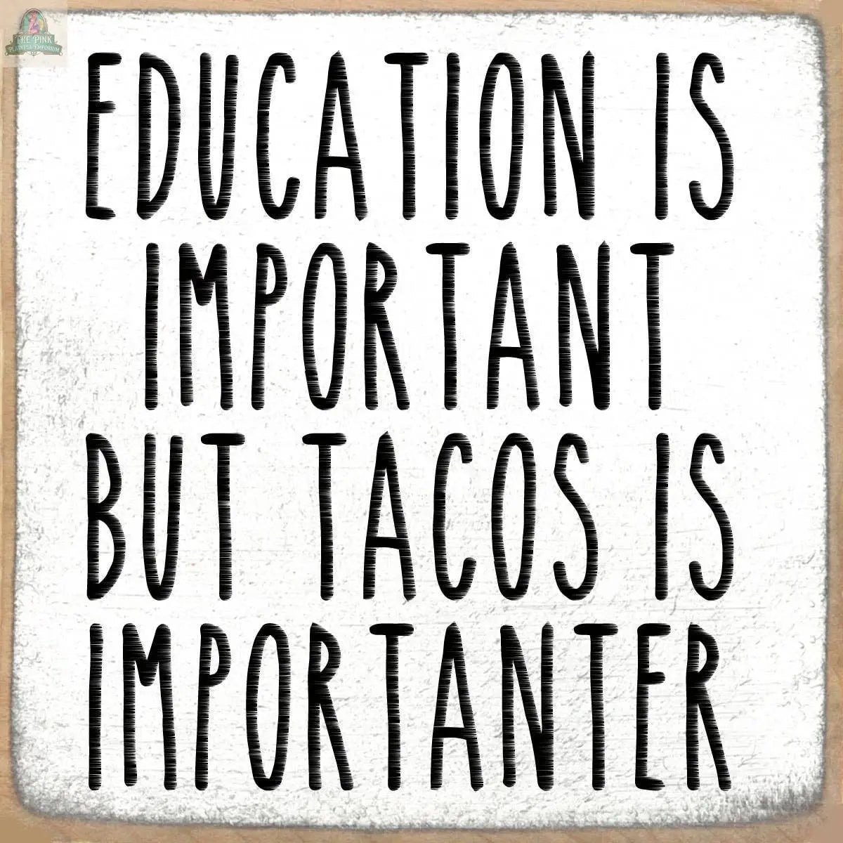 The Pink Platypus Emporium 4X4-Importanter is a white wooden block sign with black text.