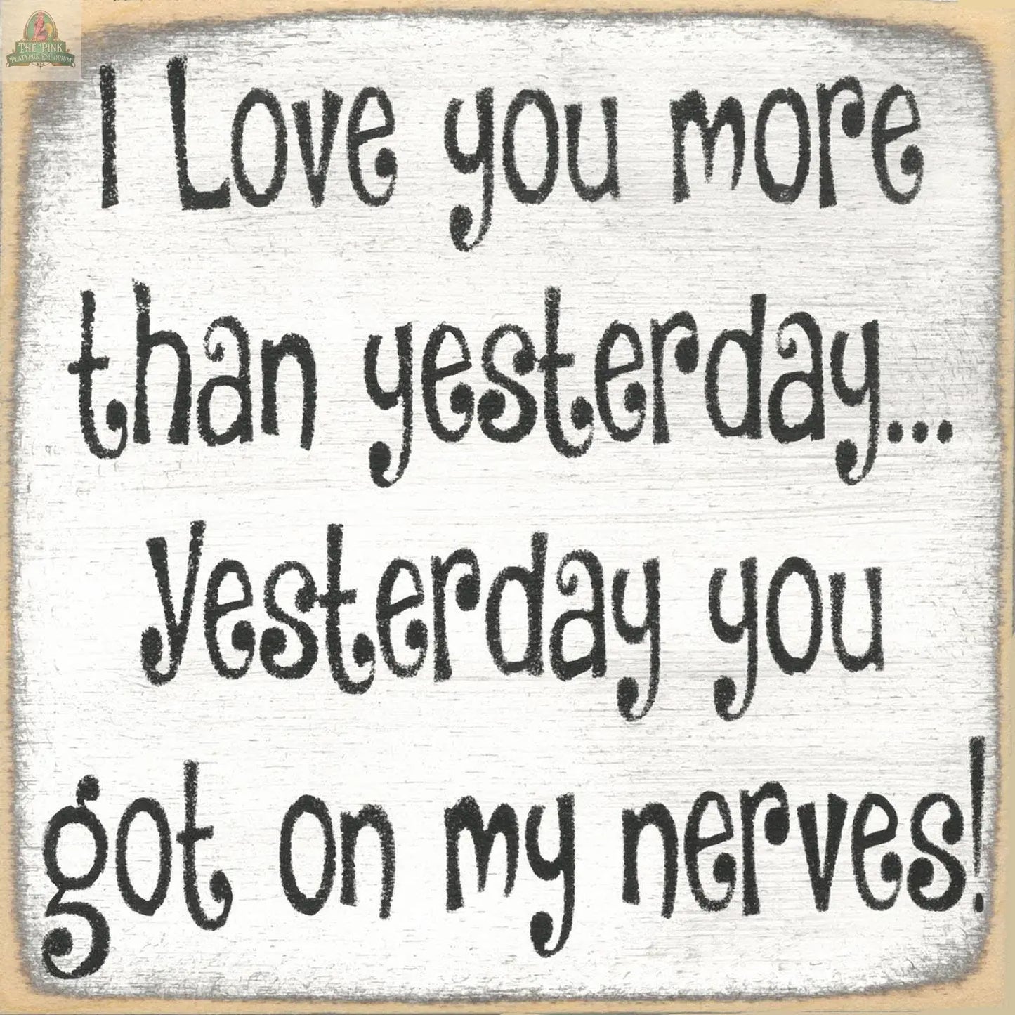 The "I love you more than Yesterday" sign by Pink Platypus Emporium features playful black text on white wood with distressed edges—perfect quirky décor for expressing affection with a vintage twist.