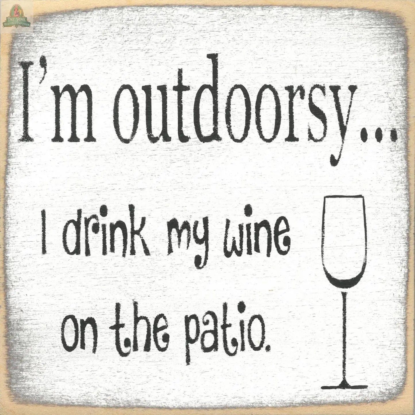 Pink Platypus Emporium’s “I’m Outdoorsy, I drink wine on Patio” sign features fun text and a wine glass illustration on a painted wood background—perfect for patio or outdoorsy decor.