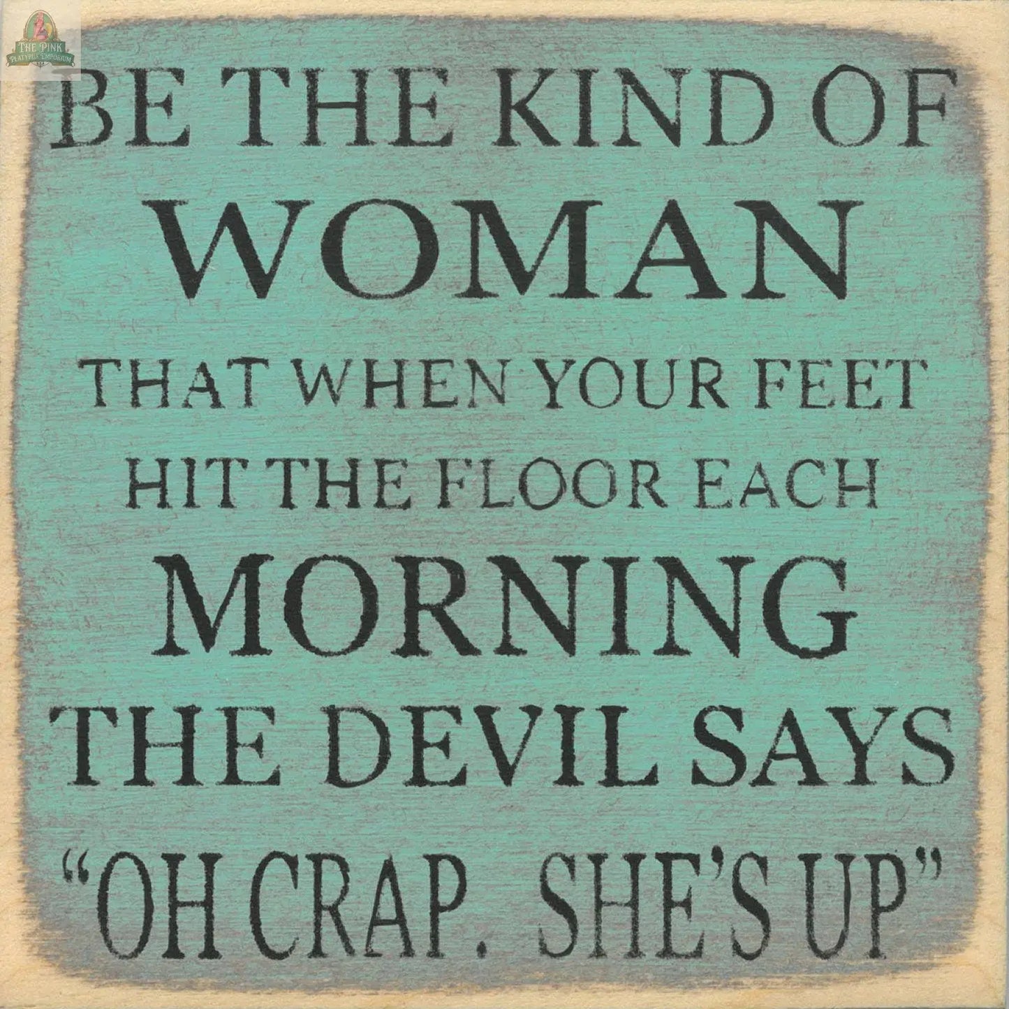 The "Be the Kind of Woman" sign by Pink Platypus Emporium features a teal and beige design with a motivating quote—perfect as inspirational home decor or a wooden block sign to uplift your space.