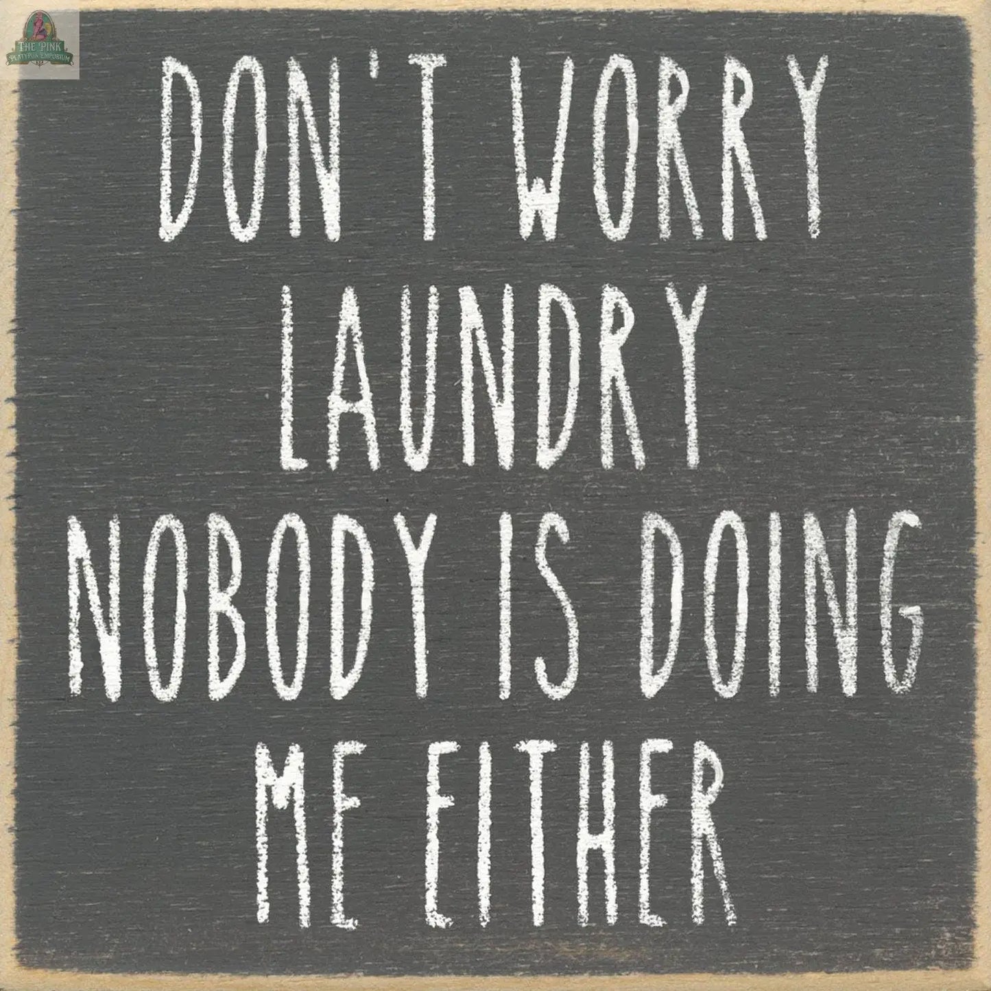 The "Don't Worry Laundry Nobodies Doing Me" sign by Pink Platypus Emporium features playful handwritten-style text, adding a humorous and personalized touch to your laundry room décor.