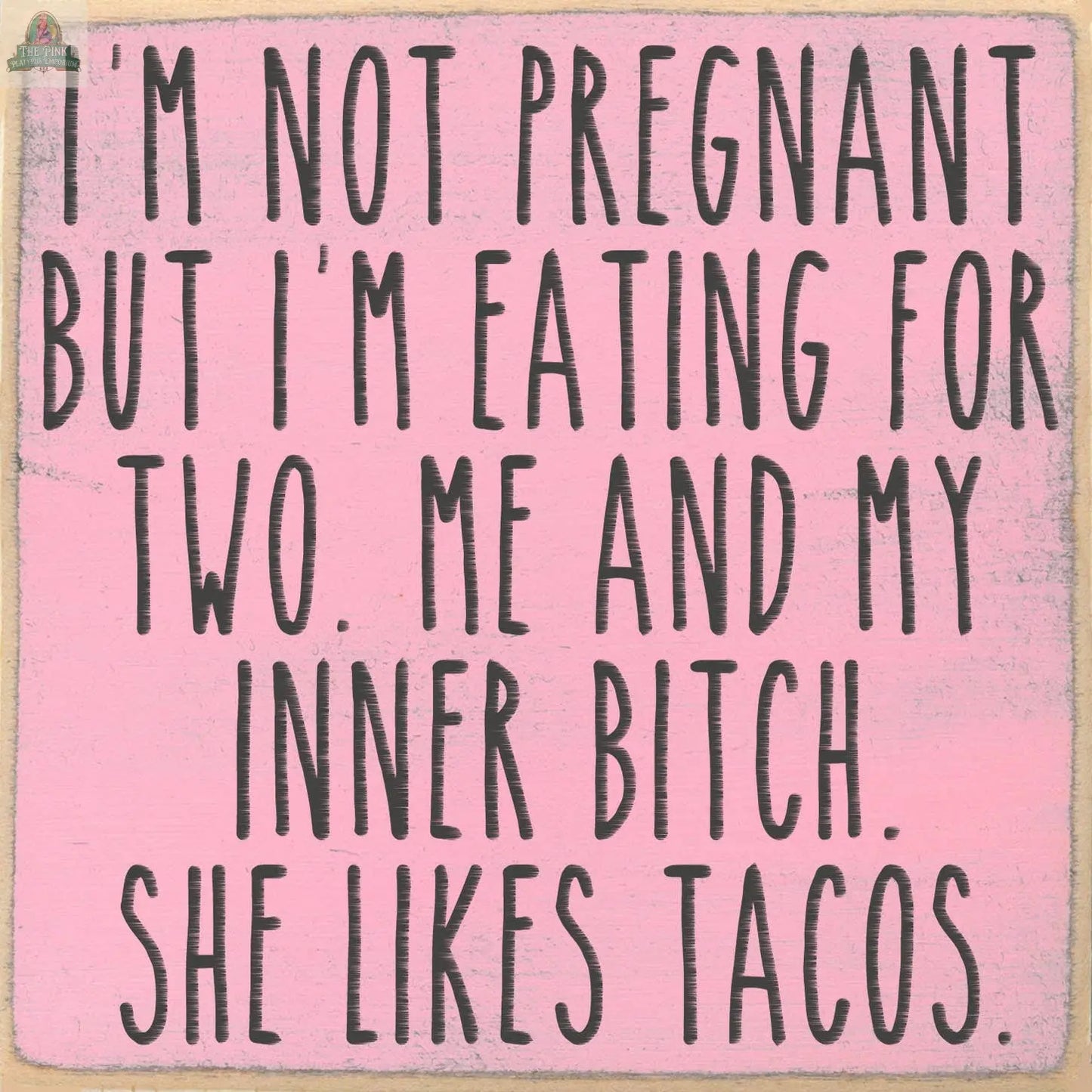 Text on a pink background reads: I’M NOT PREGNANT BUT I’M EATING FOR TWO. ME AND MY INNER BITCH. The 5x5 “My Inner Bitch Likes Tacos” wooden sign by Pink Platypus Emporium adds humor and empowerment to any space.