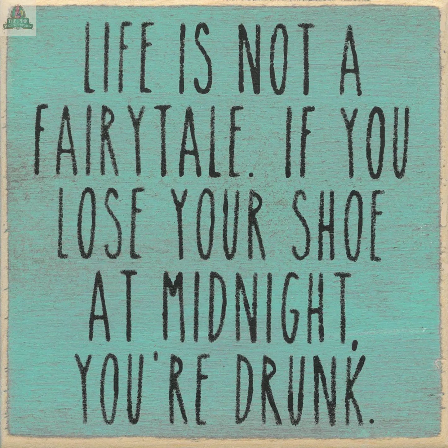 The "Life is not a fairytale" teal wooden block sign by Pink Platypus Emporium features a witty black quote, adding charming and humorous decor to your home.