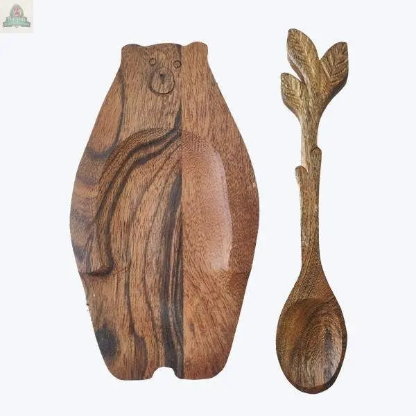 The Young's Acacia Wood Bear Charcuterie Board with Spoon Lodge features a bear-shaped design and leafy handled spoon, creating charming rustic tableware—perfect for your next gathering.