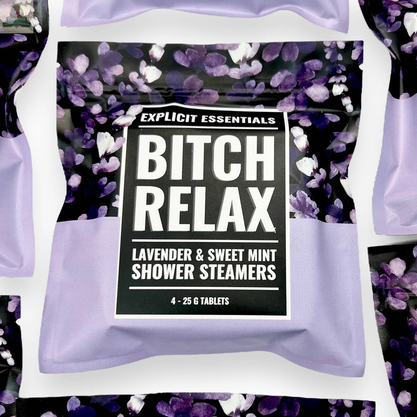 A pack of Explicit Essentials Bitch Relax Shower Steamers with a floral purple and black design contains 4 self-care shower steamers, each 25g, in lavender and sweet mint scent for relaxation.