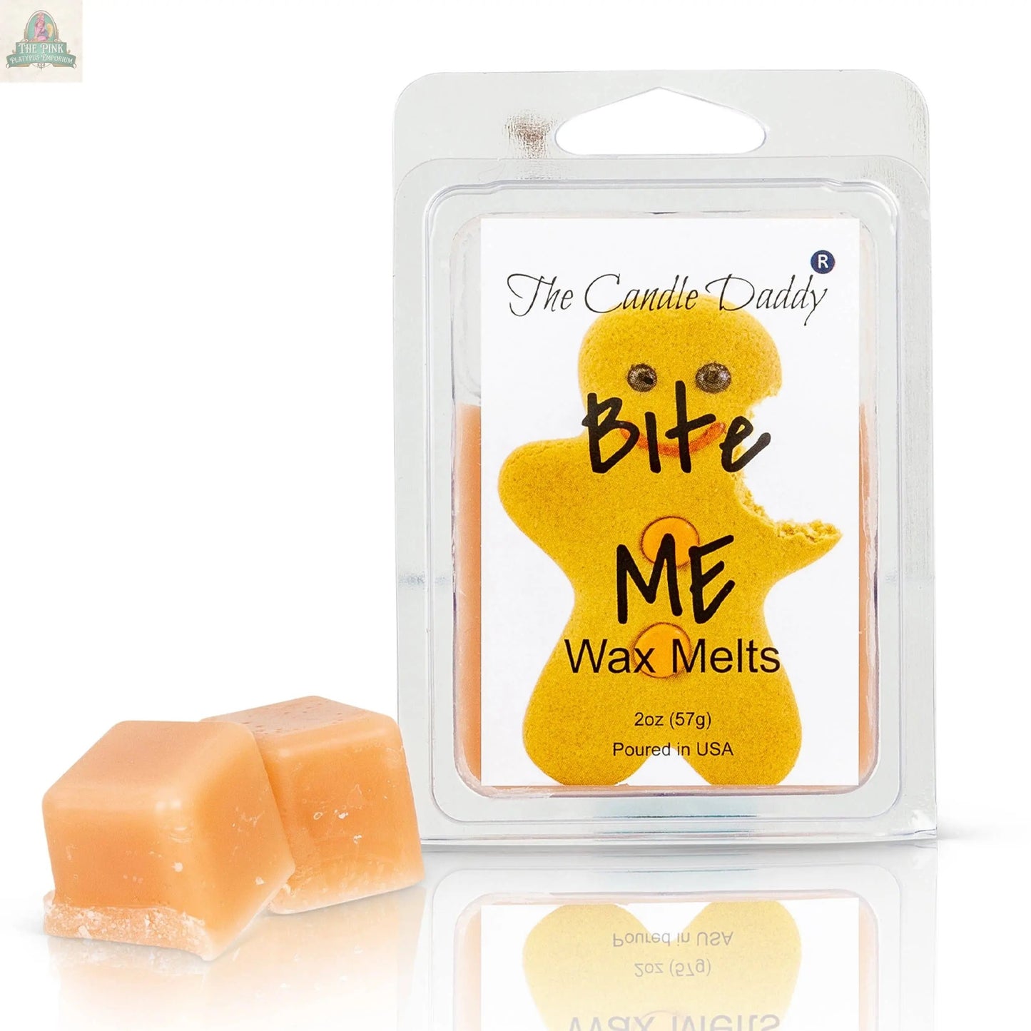 A pack of Bite Me - Funny Christmas Gingerbread Cookie Scented Wax Melts, featuring a bitten gingerbread man and two scented wax cubes next to the package.