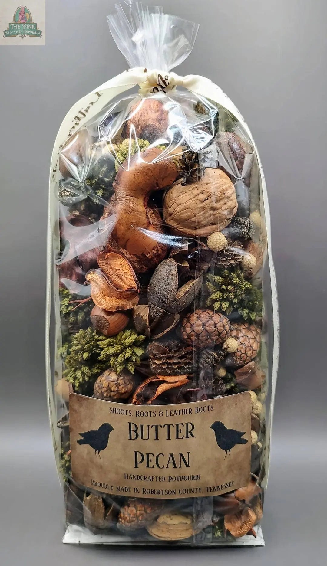 Butter Pecan Handcrafted Potpourri from Robertson County, Tennessee, comes in a clear plastic bag with decorative acorns, pinecones, and seeds visible inside and is highly scented for a fragrant display.