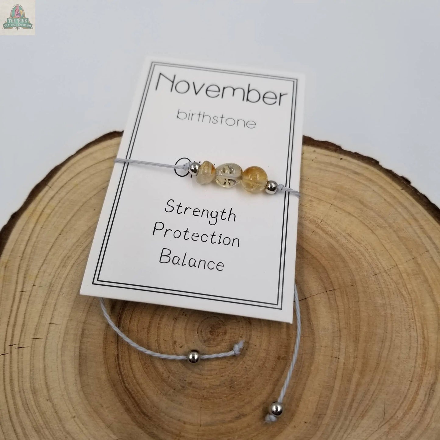 The Handmade Birthday Stone Natural Stone Bracelet with Card: December by Pink Platypus Emporium makes a unique birthday gift or accessory, perfect for fans of healing crystals.