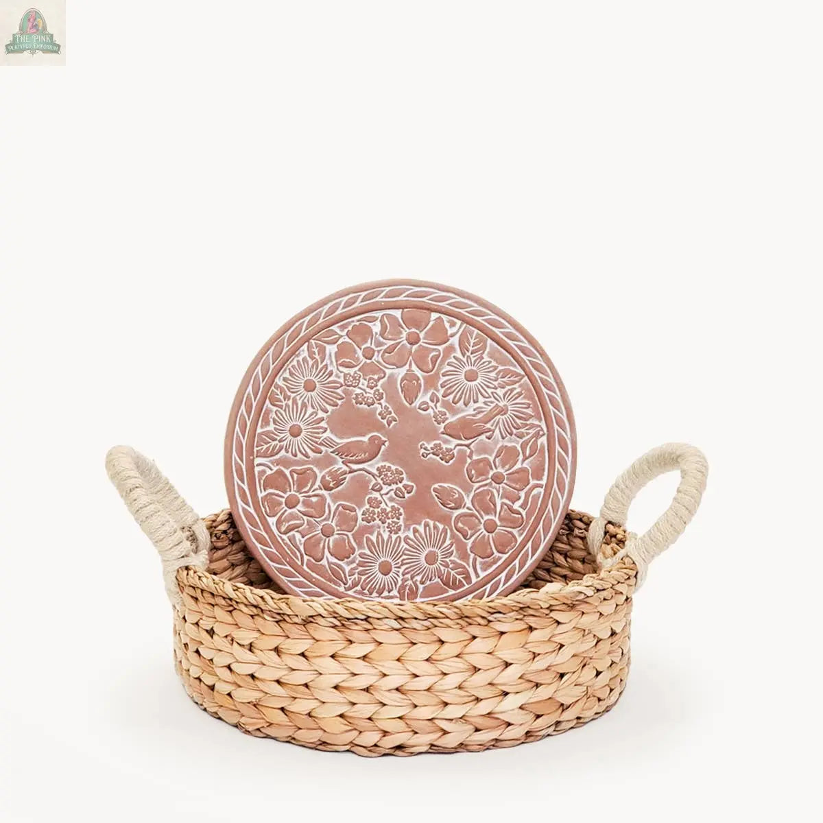 The KORISSA Handmade Bread Warmer & Wicker Basket - Garden Round features a floral-patterned terracotta warmer plate inside a two-handled basket, all displayed against a plain white background.