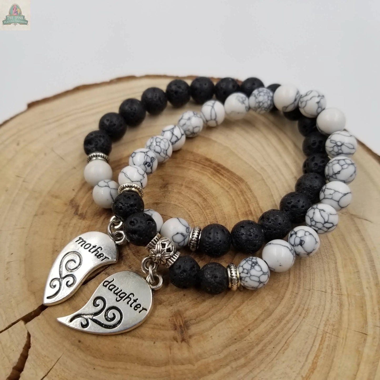 The Pink Platypus Emporium Mother's Day Combination Turquoise Bracelet Set features two bracelets with turquoise beads and matching charms that form a heart inscribed with "mother" and "daughter"—an ideal Mother’s Day gift.