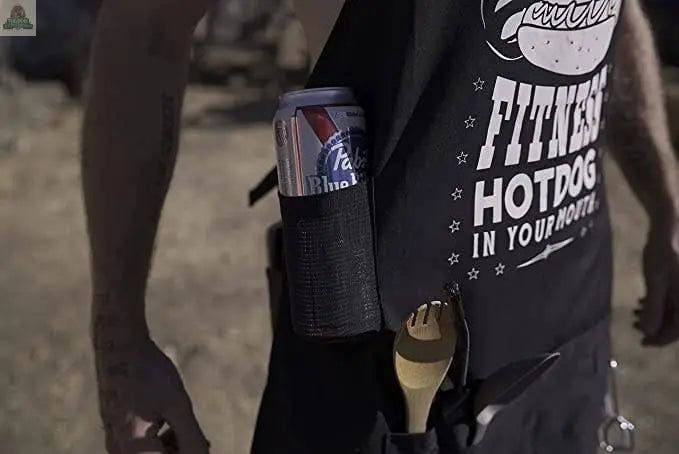 A man wearing the Pink Platypus Emporium Funny BBQ Apron-Fitness Hot Dog, holding a can of beer—a humorous apron that's the perfect BBQ gift for any grill enthusiast.