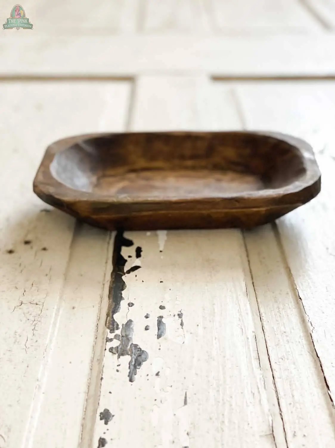 The Petite Wood Bowl, Candle Ready, Handmade, #A - 7.1 features smooth rounded edges and a natural wood finish that pairs beautifully with the distressed white wooden surface below.
