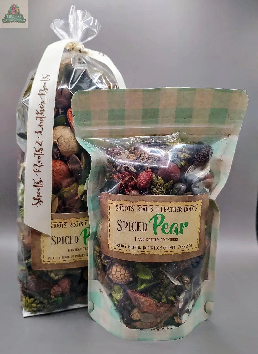 Two bags of Spiced Pear Handcrafted Potpourri (5 cups) from Pink Platypus Emporium: one upright and ribbon-tied, the other in a resealable pouch with a clear window—both filled with eco-friendly dried botanicals for home fragrance.