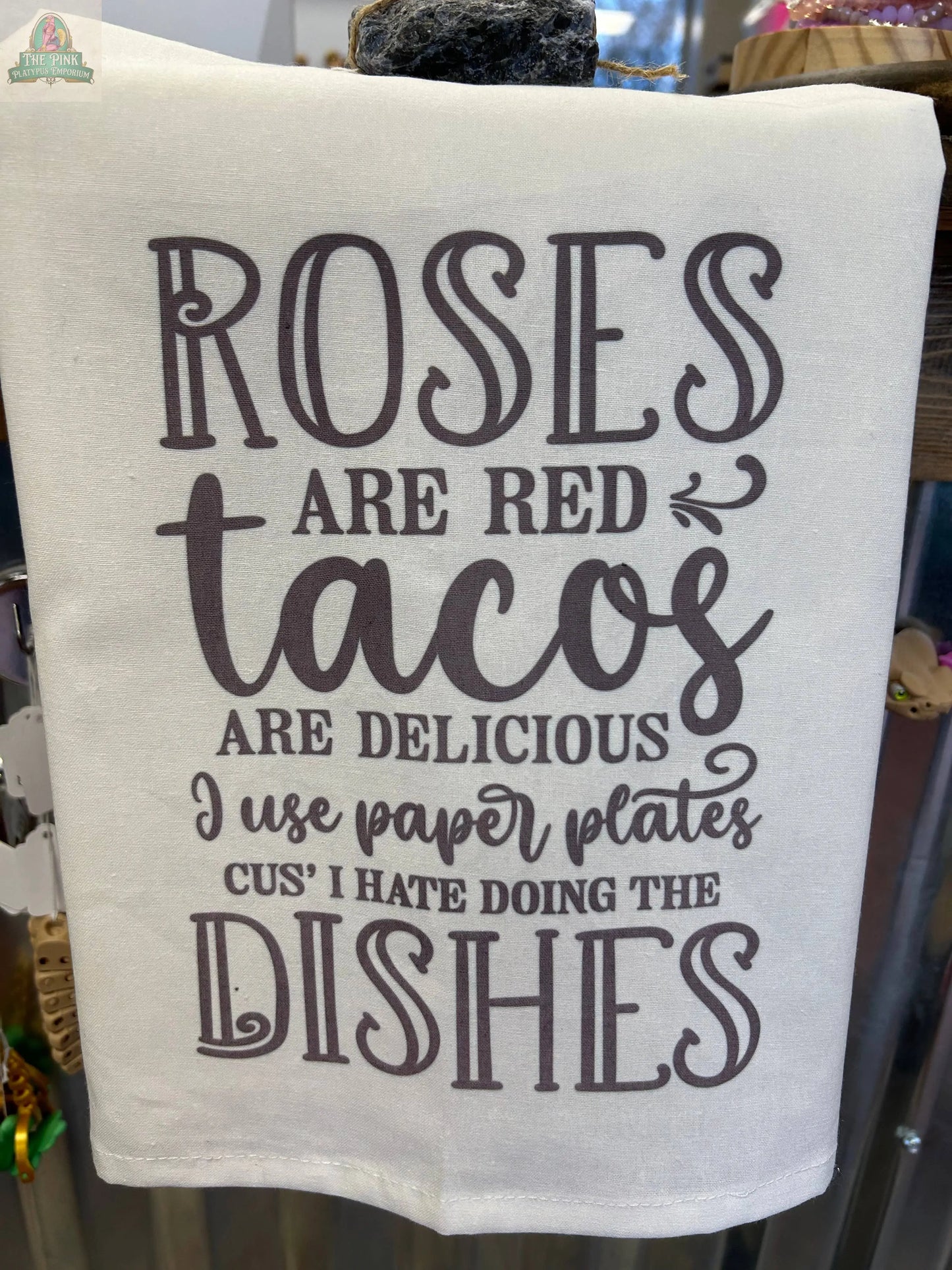 The Funny Tea Towel-Kitchen Towel Roses are red tacos are delicious by Pink Platypus Emporium features playful text and makes a quirky gift for taco lovers or anyone who enjoys humor in their kitchen.