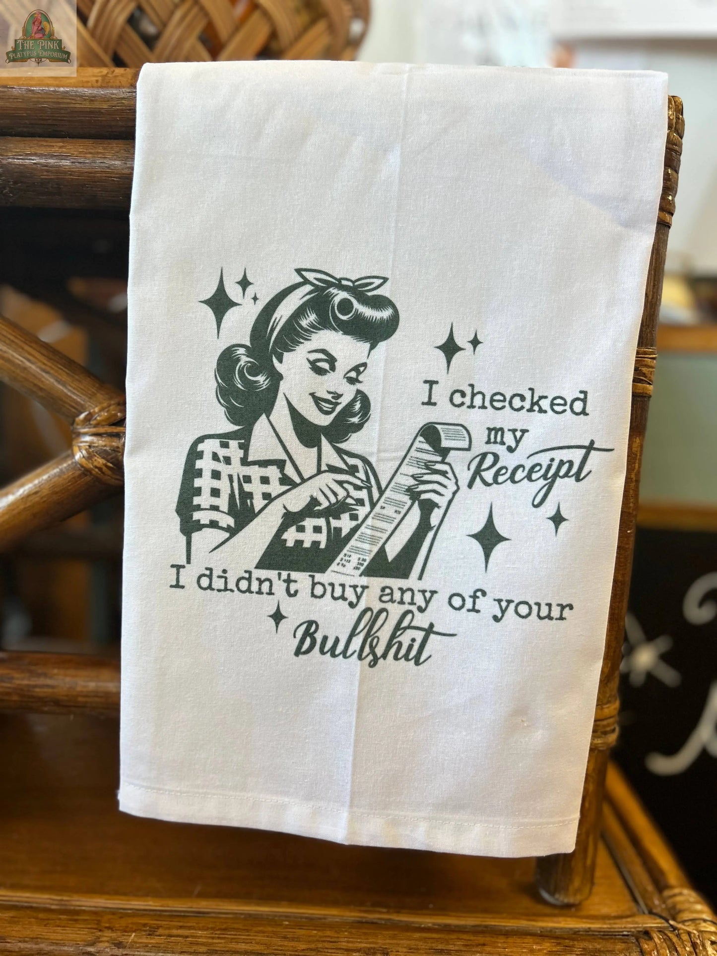 The Pink Platypus Emporium Funny Tea Towel features a retro woman with a receipt and the phrase “I checked my receipt. I didn’t buy any of your bullshit”—a quirky kitchen accent sure to get laughs!.