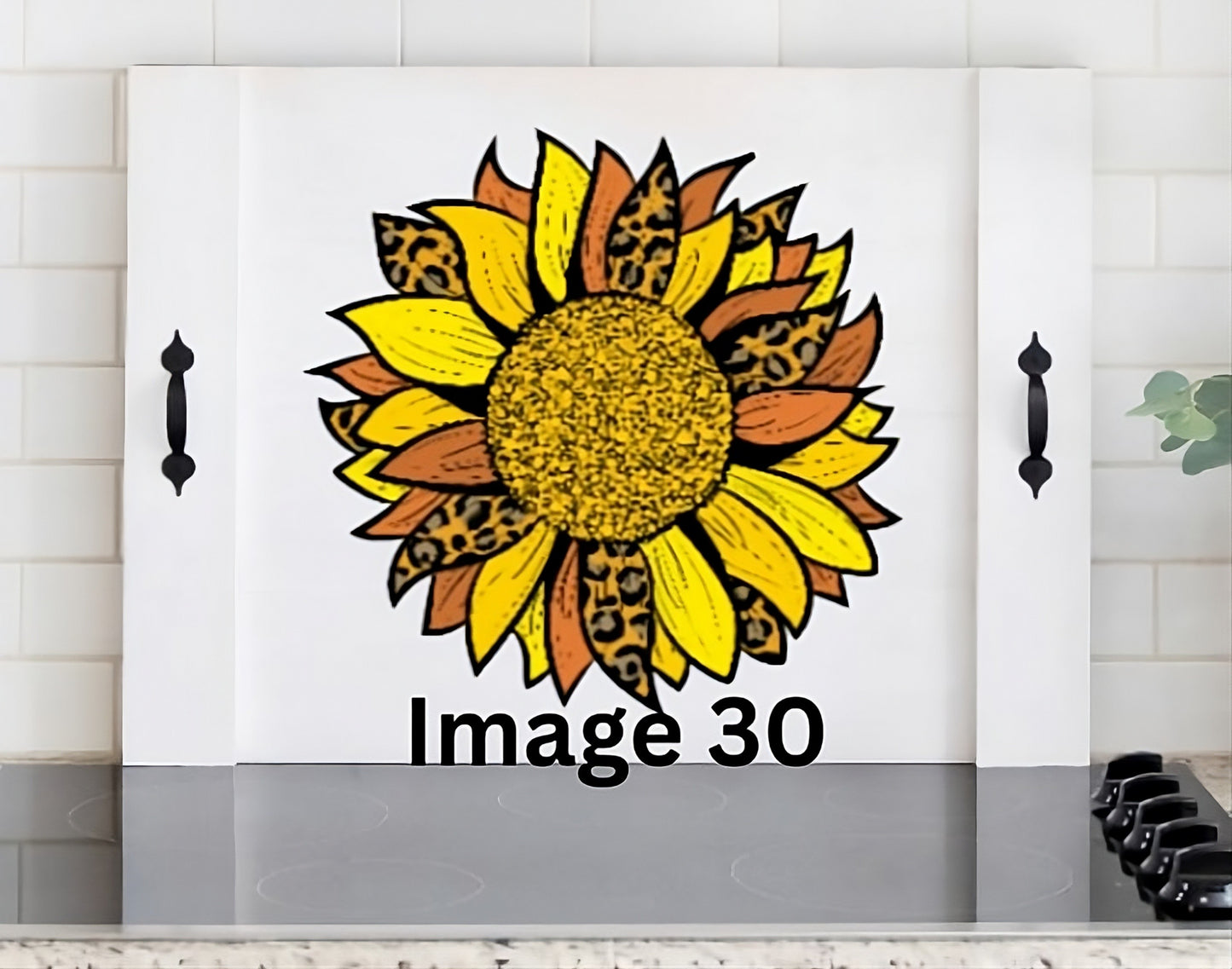 Leopard sunflower wooden stove cover with yellow rust and animal print petals, decorative noodle board for farmhouse and country kitchen decor.