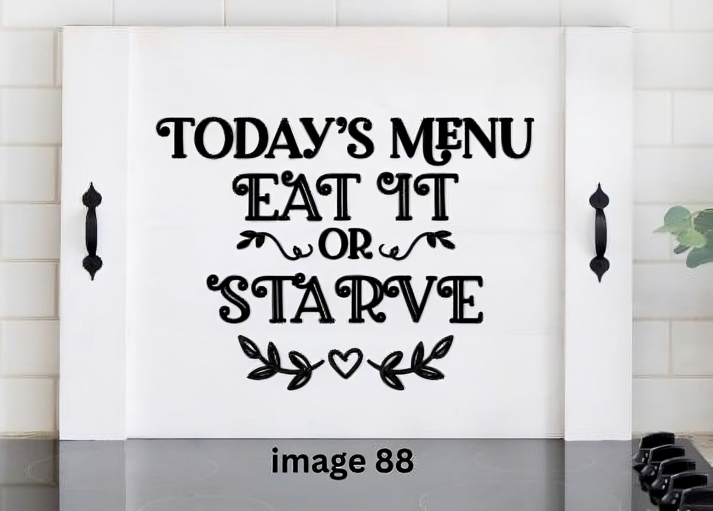 Pink Platypus Emporium funny stove cover featuring Today’s Menu Eat It or Starve on a solid wood farmhouse noodle board with black handles.