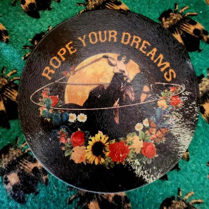 glass cutting board with 'Rope Your Dreams' text and floral design on a patterned background - quirky home decor
