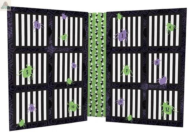 The 12 Days of Beetlejuice Advent is an open calendar with numbered doors 1–12 on a black-and-white striped background, featuring green and purple cartoon bugs and a green patterned strip down the center.