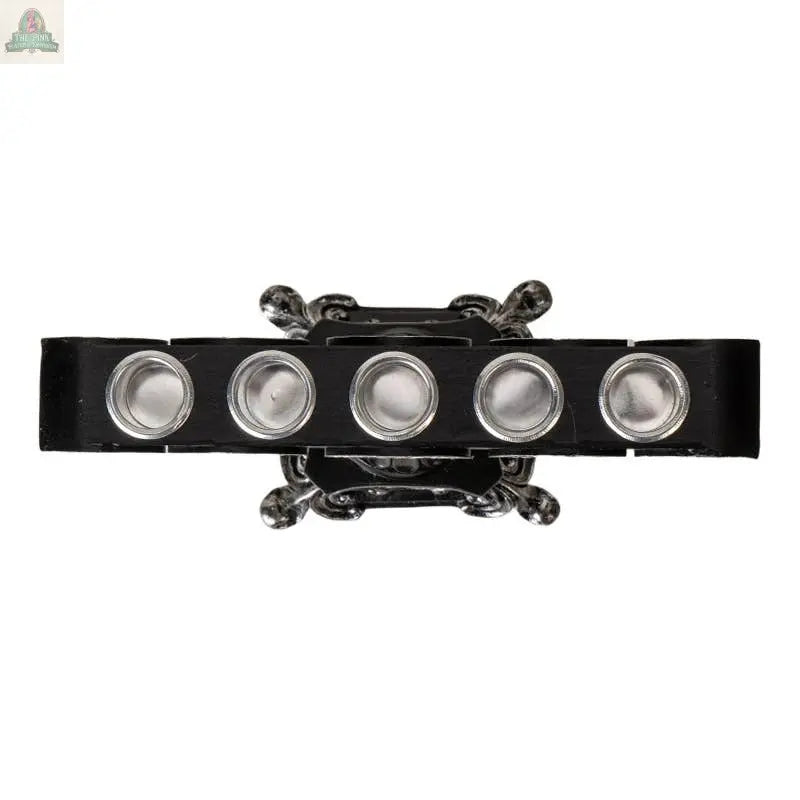 The Triple Moon Candleholder is a black and silver metal menorah with six round candle holders, shown from above on a white background.