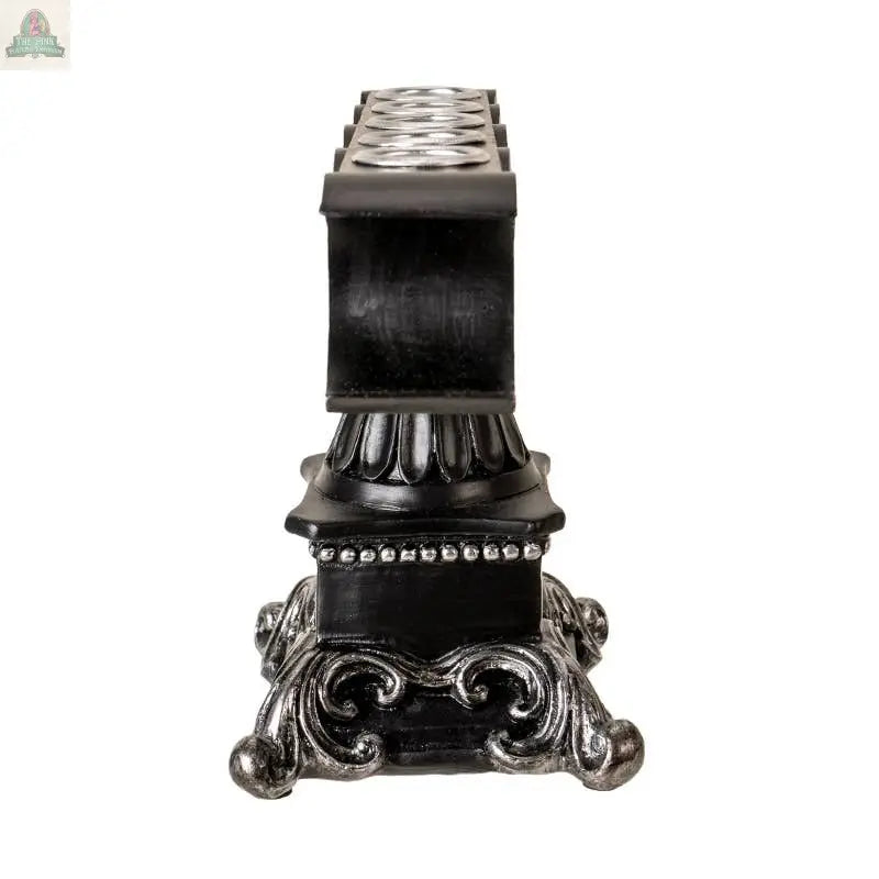 The Triple Moon Candleholder is an ornate black and silver cold cast resin pedestal with decorative scrollwork and beading, shown from the front on a white background.