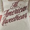 Textured fabric with 'All American Sweetheart' printed on it