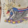 T-shirt with American flag and swan design on a plain background