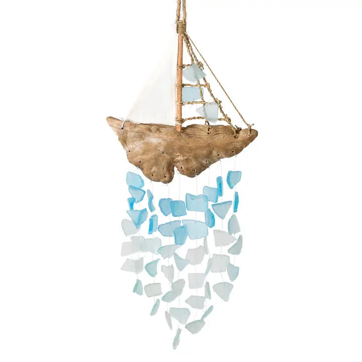 Decorative sailboat-shaped wind chime with blue and white glass pieces on a white background