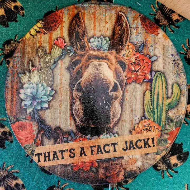 Decorative glass cutting board with a donkey illustration, flowers, and text on a teal background - quirky housewarming gift