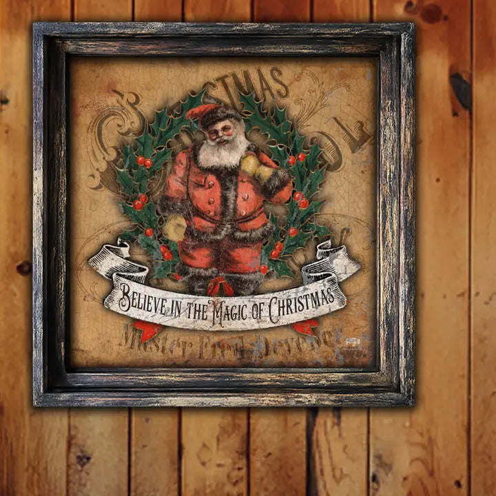 Framed Christmas-themed artwork with Santa Claus and holly on a wooden background