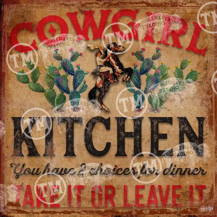 Decorative sign with cowgirl and cacti design, text 'Cowgirl Kitchen' and 'Take it or Leave it', on a rustic background.
