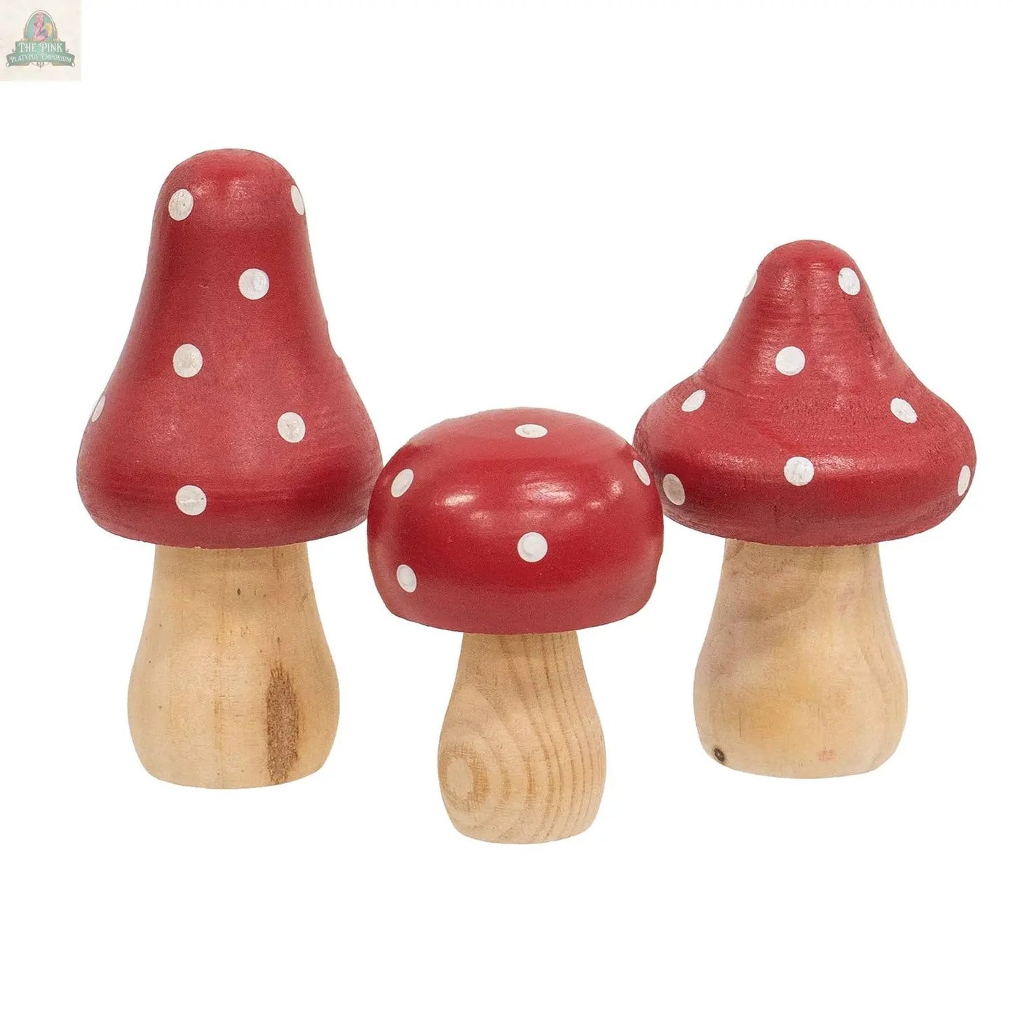 The 3/Set - Red & White Dotted Wooden Mushrooms feature natural-colored stems and red caps with white polka dots, making them a charming springtime display decor to brighten any space.