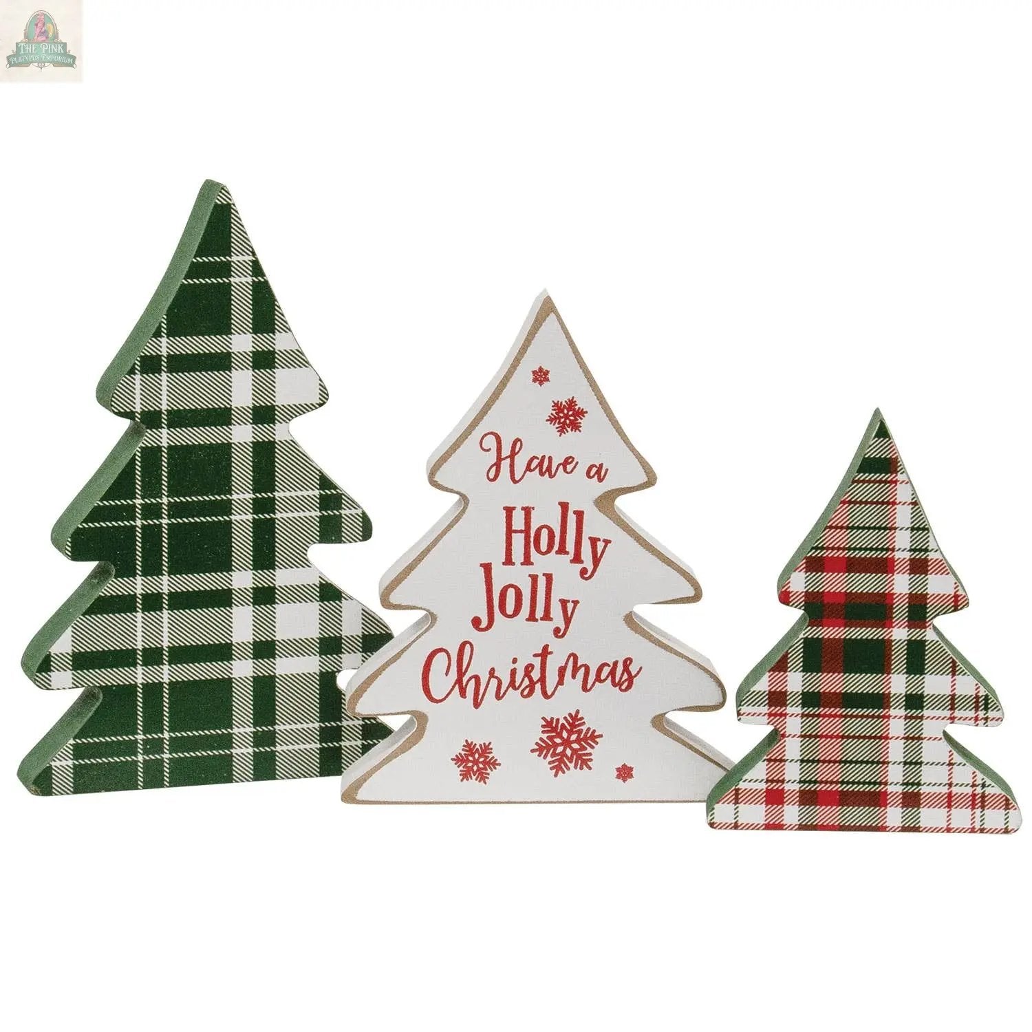The 3/Set Wooden Holly Jolly Plaid Christmas Trees includes one green plaid, one red and green plaid, and one white tree with "Have a Holly Jolly Christmas" in red—perfect for farmhouse or plaid Christmas decor.