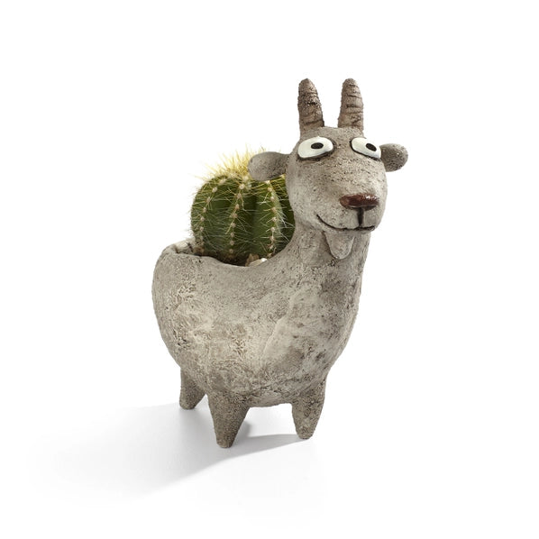 goat-shaped planter with a cactus inside on a white background