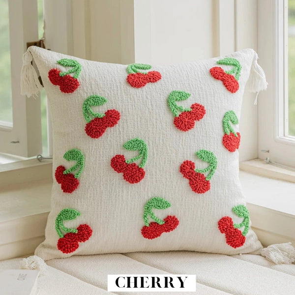 Decorative pillow with cherry pattern on a light background