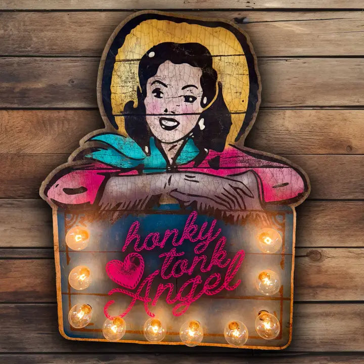 Decorative sign with a cartoon character and 'honky tonk angel' text on a wooden background