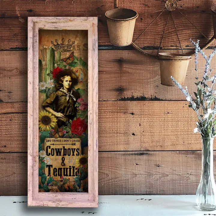 Western wall art with a cowboy and tequila text on a wooden wall.