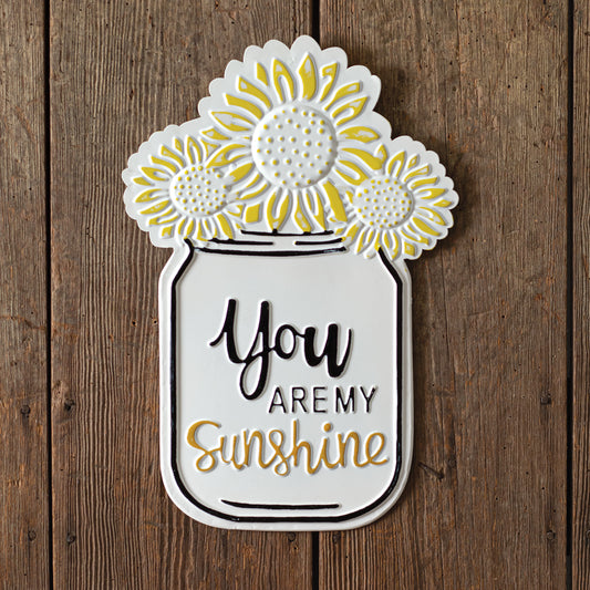 Decorative cutout of a mason jar with sunflowers and 'You are my sunshine' text on a wooden background