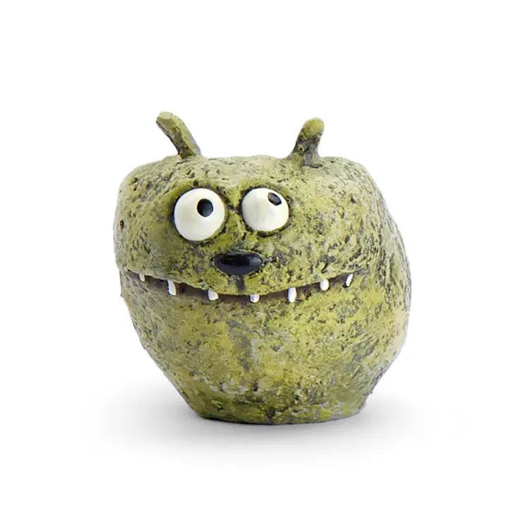 Green monster-like planter with large eyes and a small mouth on a white background
