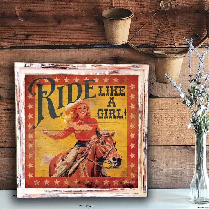 Vintage-style poster with a woman riding a horse and text 'Ride Like a Girl!' on a wooden wall.