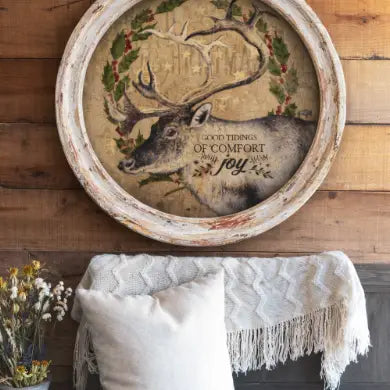 farmhouse wall decor with a deer illustration and text on a wooden background