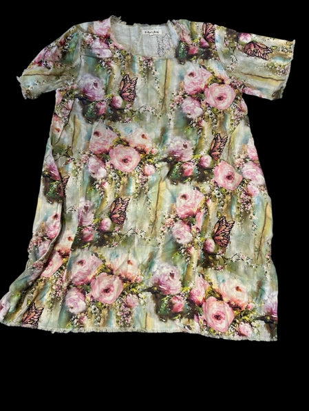 Floral dress with pink flowers and green leaves on a black background