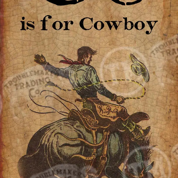 Western wall art of a cowboy on horseback with text 'C is for Cowboy' on a vintage map background.