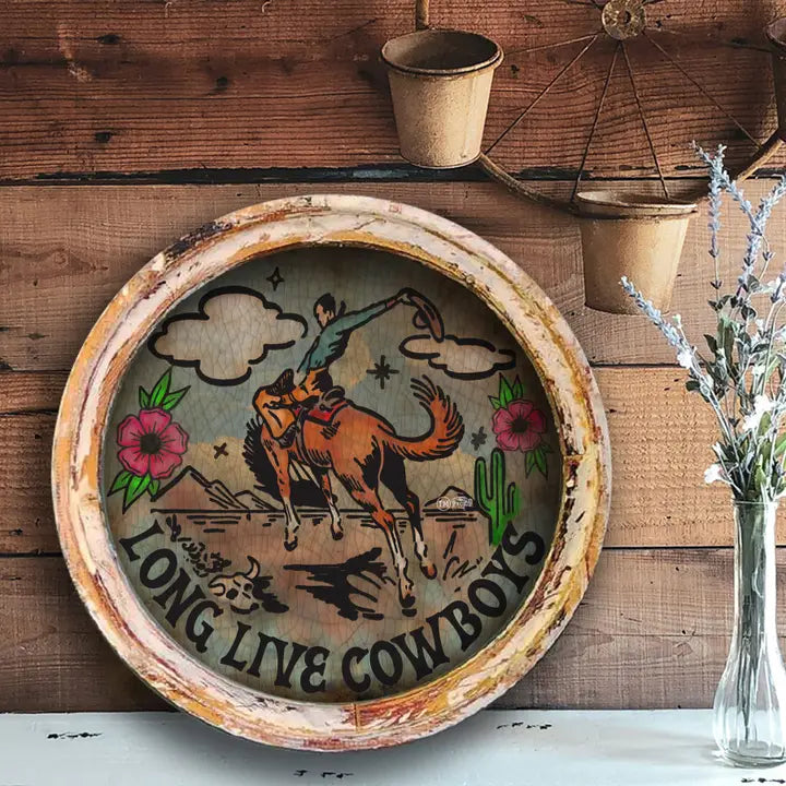 Western wall art with cowboy design on a wooden wall