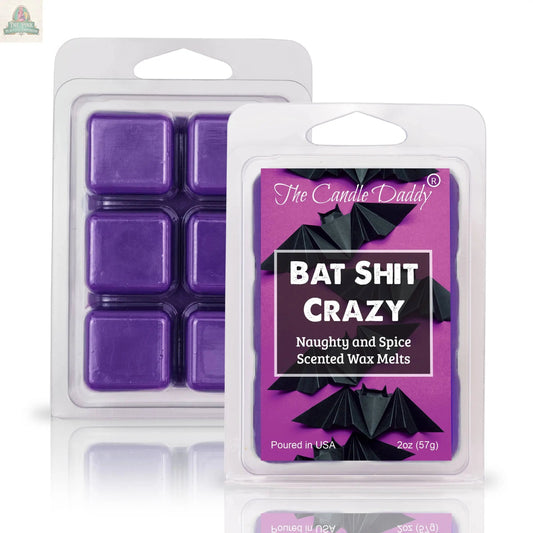 Two plastic packs of purple wax melts labeled “BAT SHIT CRAZY - NAUGHTY AND SPICE SCENTED WAX MELT” by The Candle Daddy, featuring black bats—an ideal, strong-scented aromatherapy gift.