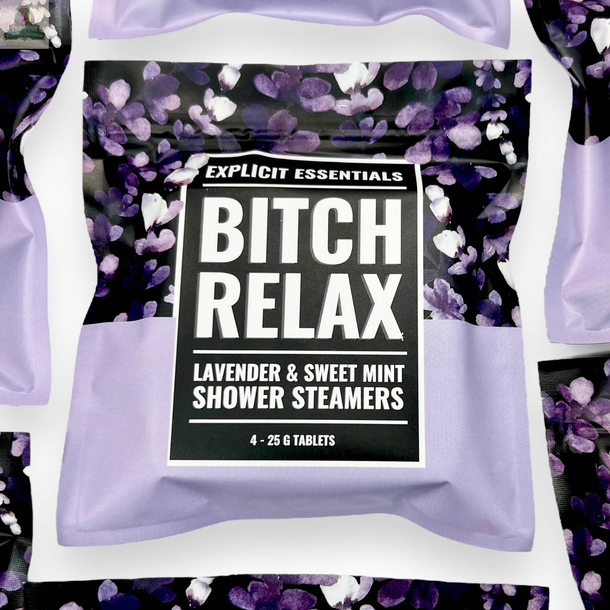 A pack of Explicit Essentials Bitch Relax Shower Steamers with a floral purple and black design contains 4 self-care shower steamers, each 25g, in lavender and sweet mint scent for relaxation.