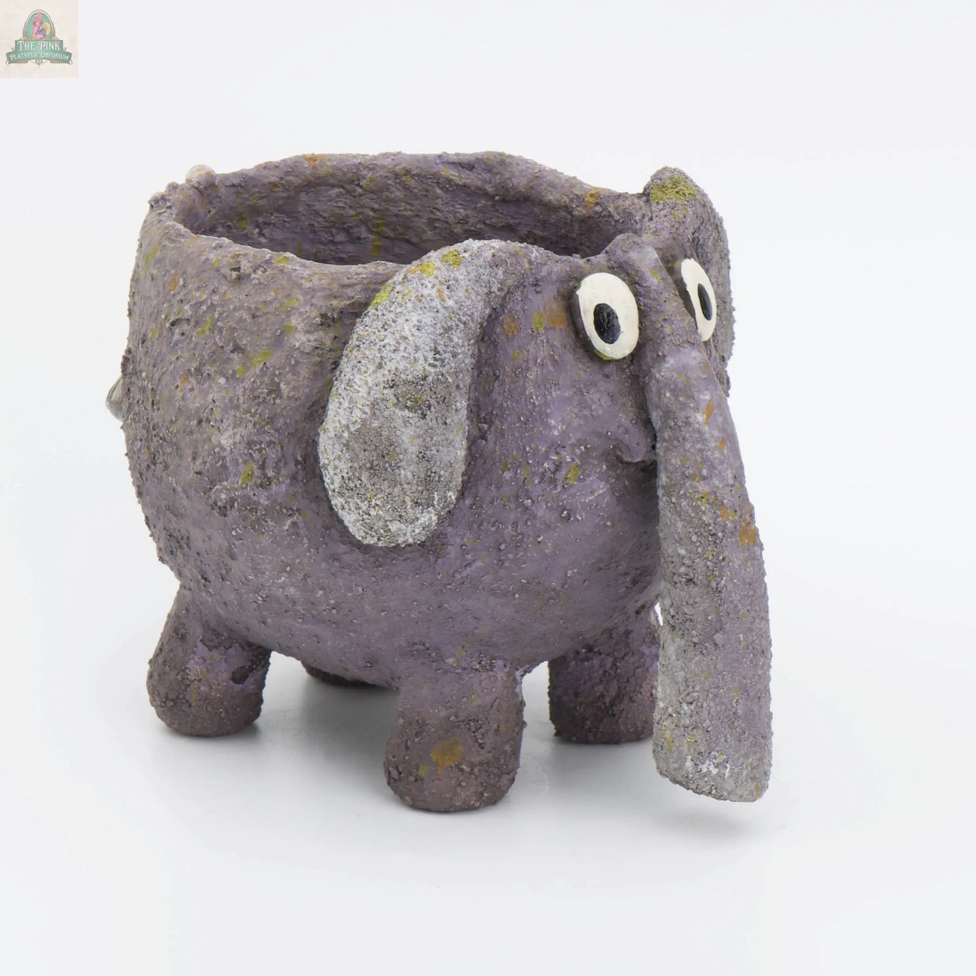 The BoBo the Elephant Blobhouse Planter by Blob House Planters is a small, handmade, purple elephant planter with textured skin, big floppy ears, and a long trunk—perfect for displaying your favorite succulents.